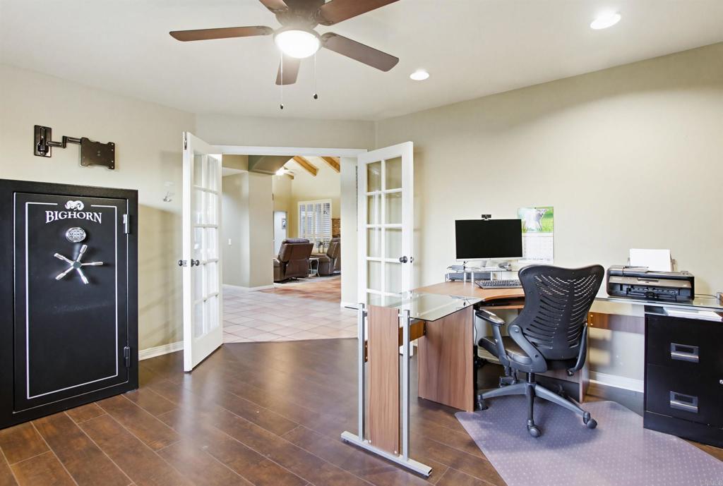 2092 Tudor Lane Fallbrook, CA 92028 - Photo 26 of 52 a view of a workspace with furniture and a ceiling fan
