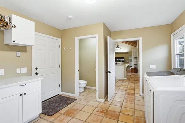 a kitchen with a sink cabinets and window