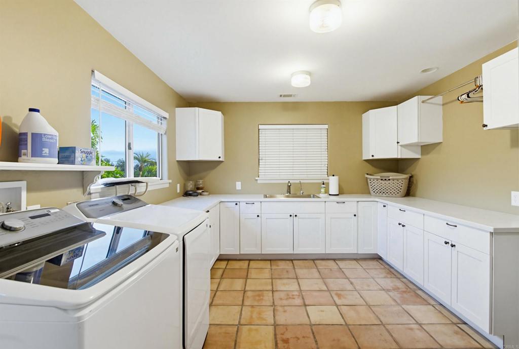 2092 Tudor Lane Fallbrook, CA 92028 - Photo 28 of 52 a kitchen with a sink cabinets and window