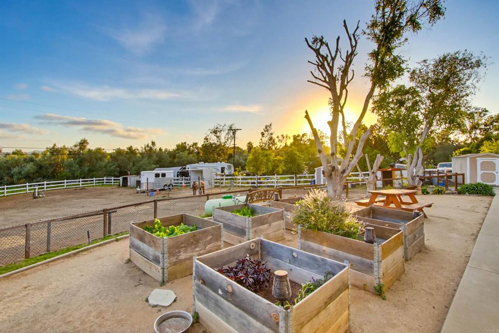 2092 Tudor Lane Fallbrook, CA 92028 - Photo 30 of 52 a view of a swimming pool with couches and wooden fence