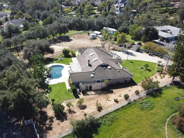 a view of houses with a yard