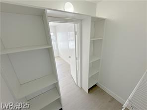 7255 West Sunset Road, Unit 2046 Las Vegas, NV 89113 - Photo 17 of 28 Seamless shelving provides abundant storage and easy access within this well-appointed closet.