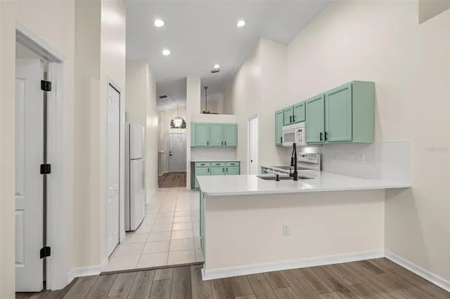 a view of a kitchen from the hallway