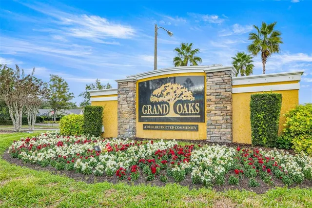 a sign that is in front of flowers