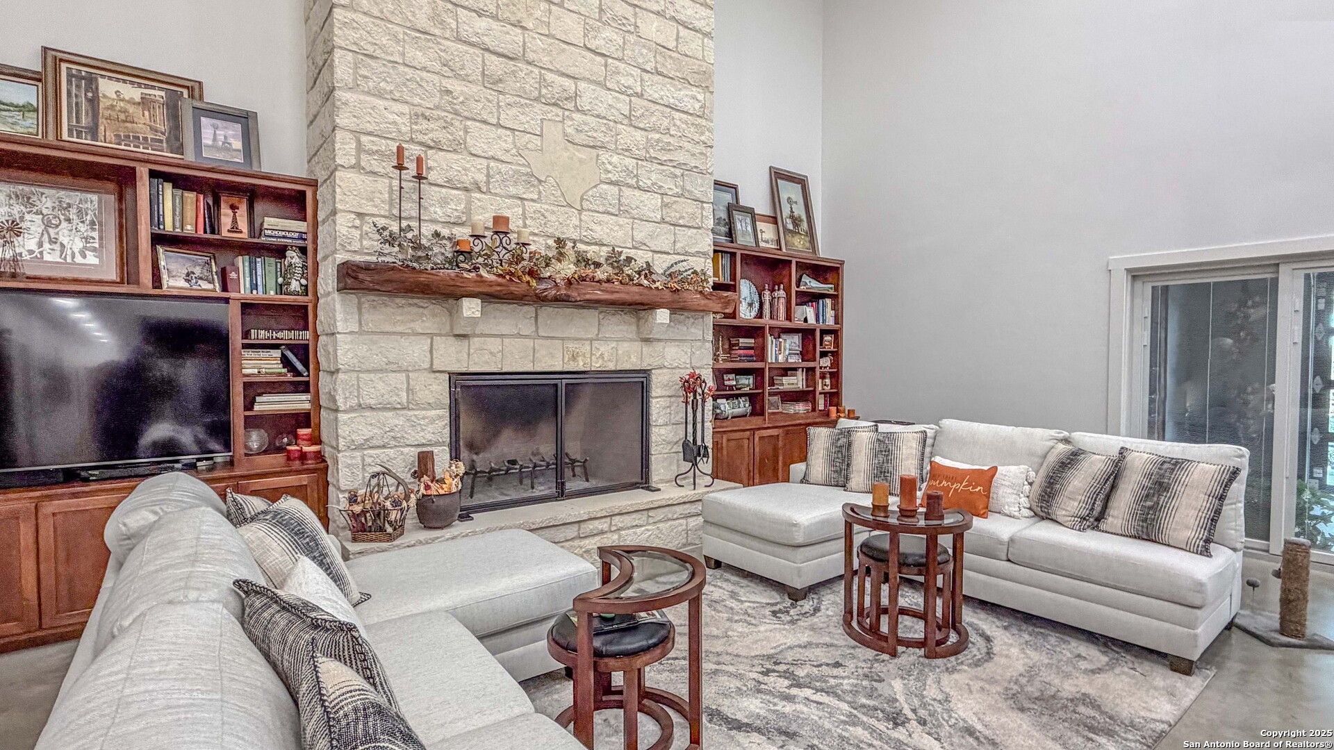 21789 Fm 2093 Harper, TX 78631 - Photo 28 of 98 a living room with furniture a flat screen tv and a fireplace