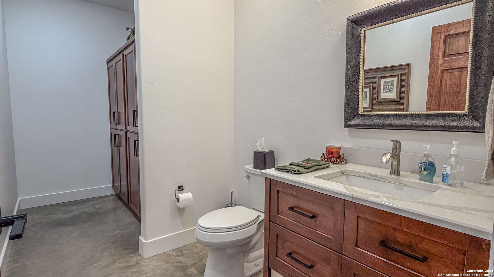 21789 Fm 2093 Harper, TX 78631 - Photo 46 of 98 a bathroom with a granite countertop toilet sink and mirror