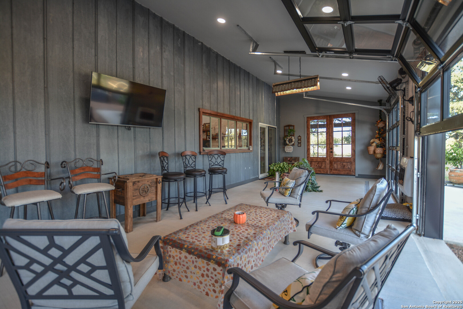 21789 Fm 2093 Harper, TX 78631 - Photo 52 of 98 a living room with furniture a flat screen tv and kitchen view