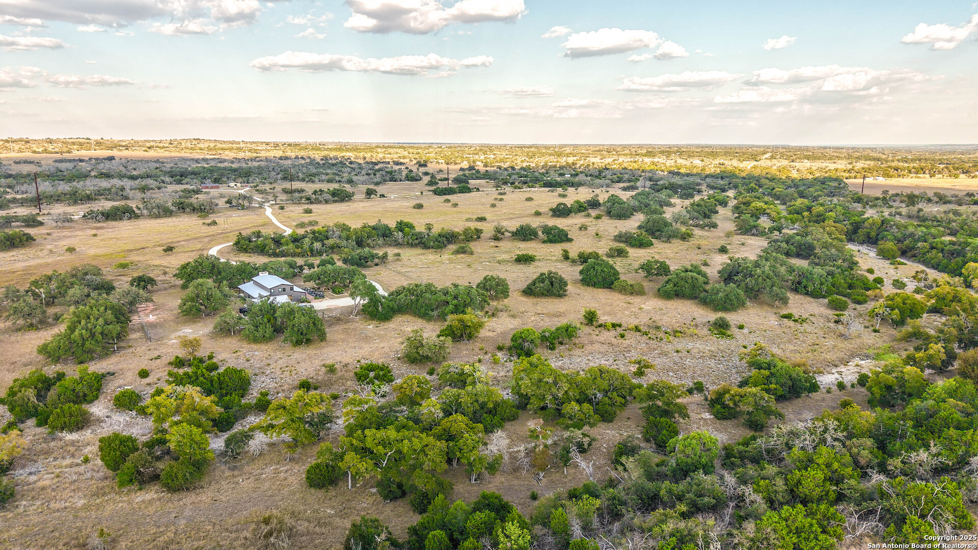 21789 Fm 2093 Harper, TX 78631 - Photo 73 of 98 an aerial view of residential houses with outdoor space and trees
