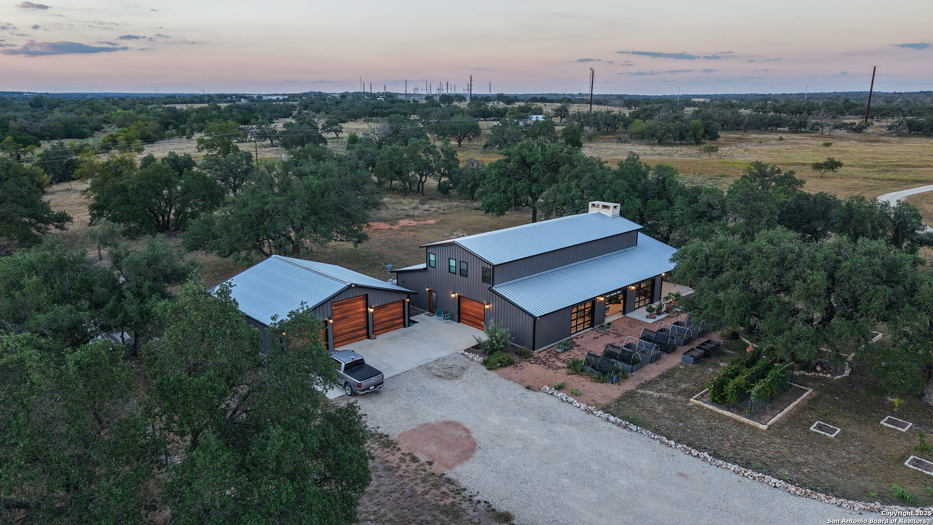 21789 Fm 2093 Harper, TX 78631 - Photo 9 of 98 an aerial view of a house with a garden and lake view