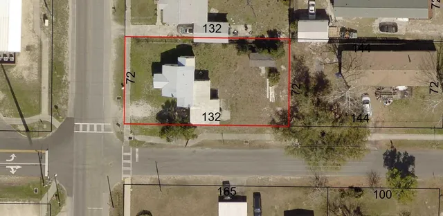 an aerial view of a houses with outdoor space
