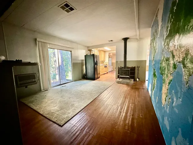 a view of kitchen island with wooden floor