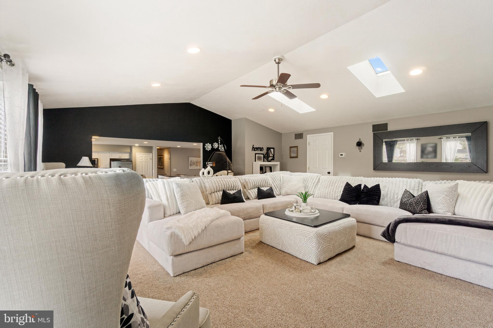 8339 Capel Drive Pasadena, MD 21122 - Photo 16 of 51 a living room with furniture and a large mirror
