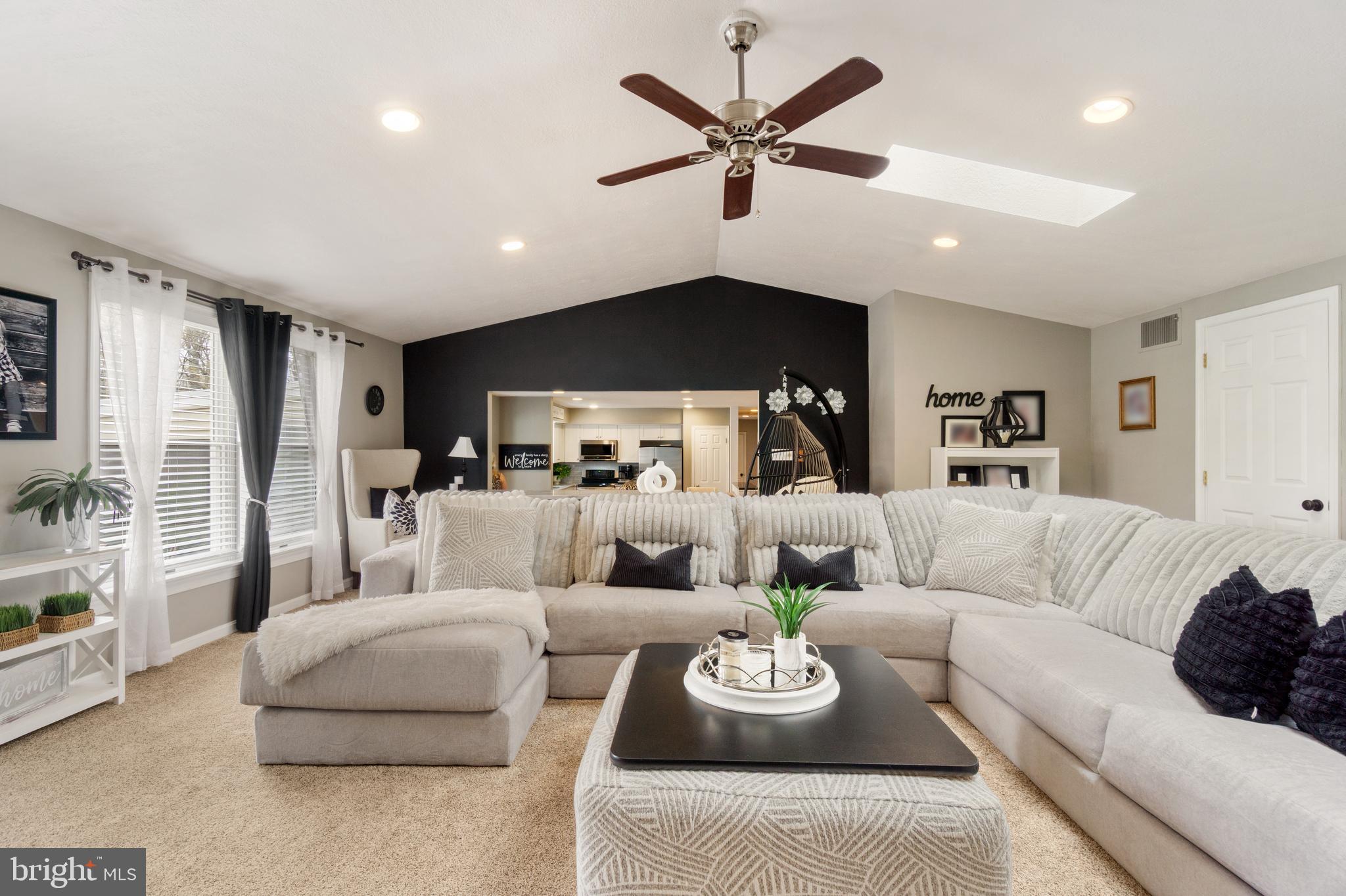 8339 Capel Drive Pasadena, MD 21122 - Photo 17 of 51 a living room with furniture and a large window
