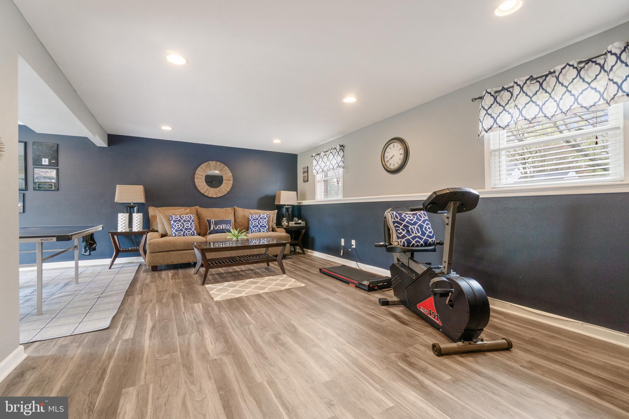 8339 Capel Drive Pasadena, MD 21122 - Photo 37 of 51 a view of a room with wooden floor and windows
