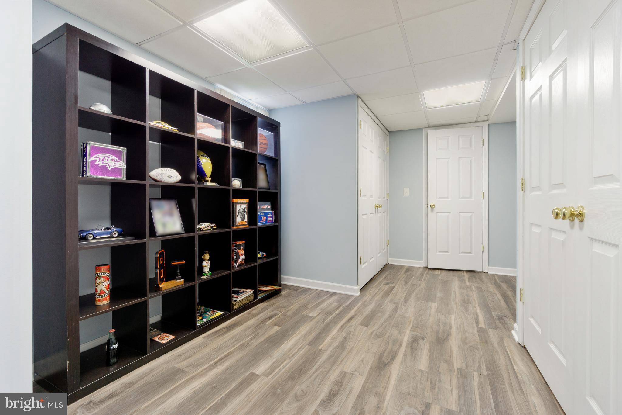 8339 Capel Drive Pasadena, MD 21122 - Photo 46 of 51 a view of walk in closet with empty racks