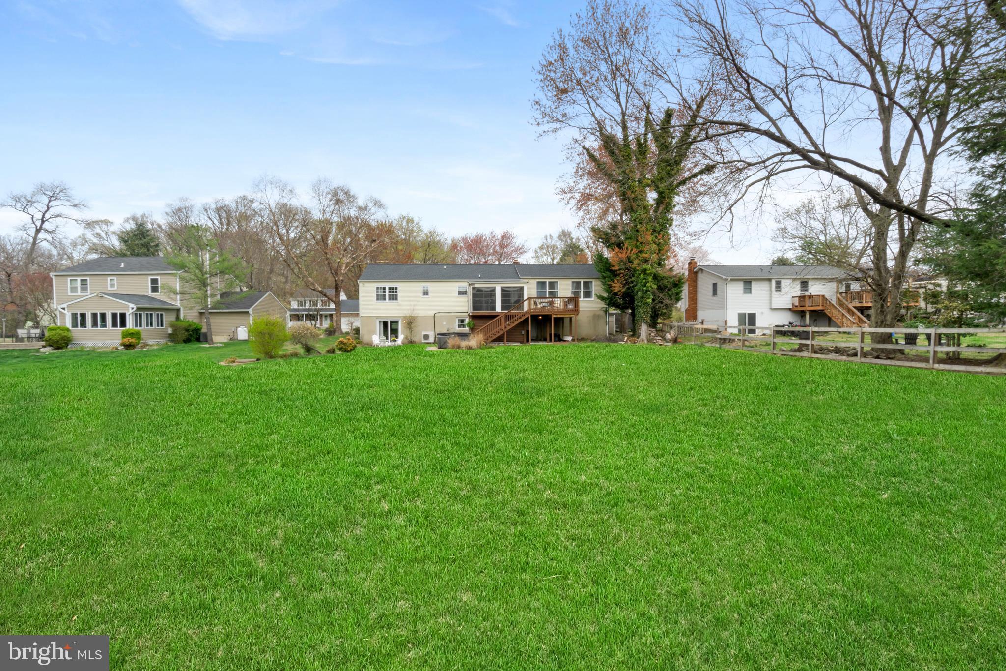 8339 Capel Drive Pasadena, MD 21122 - Photo 51 of 51 a view of a house with a big yard and large trees