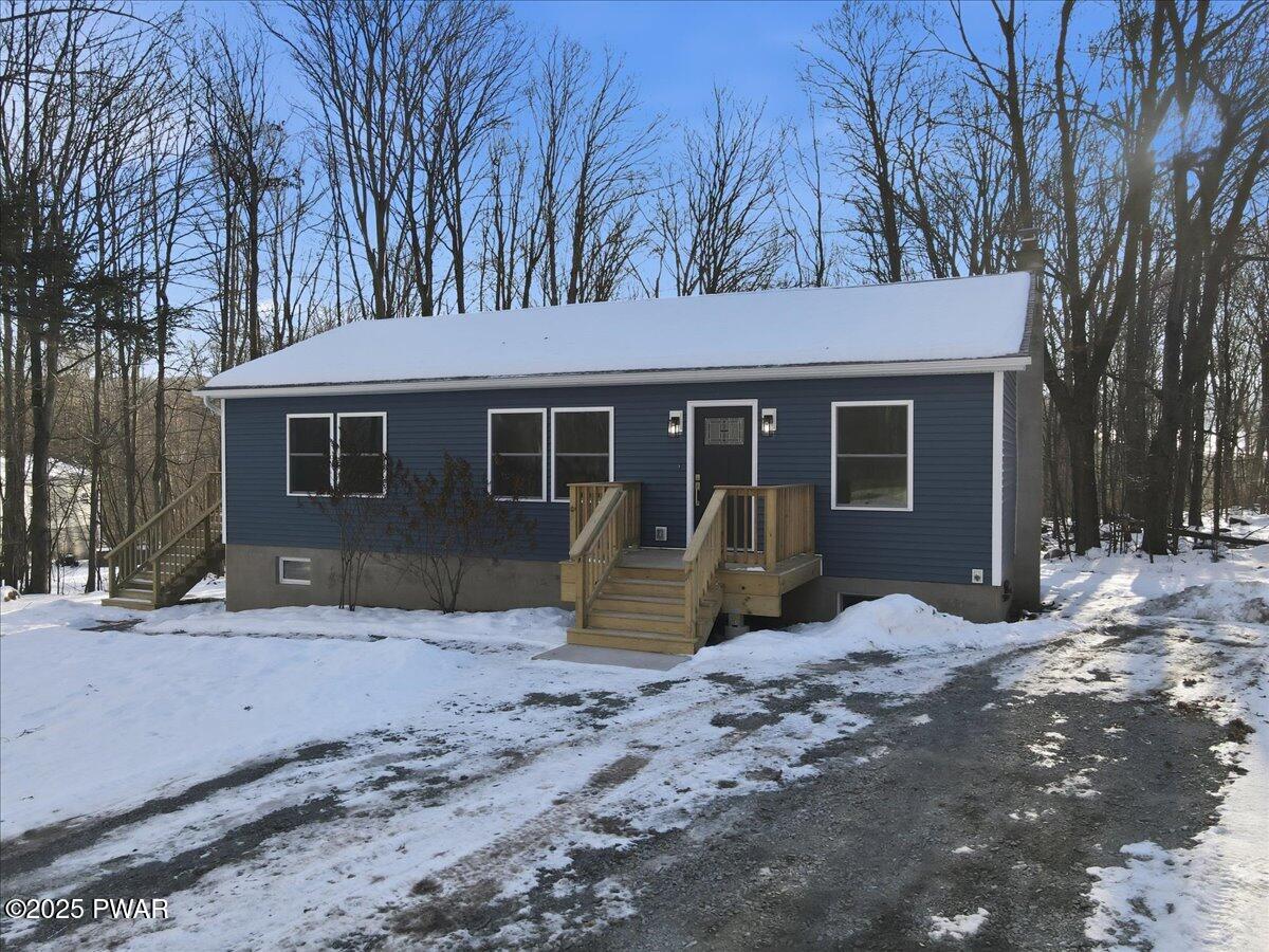 10 Swingle Road Moscow, PA 18444 - Photo 8 of 60 a view of a house with a yard covered in snow