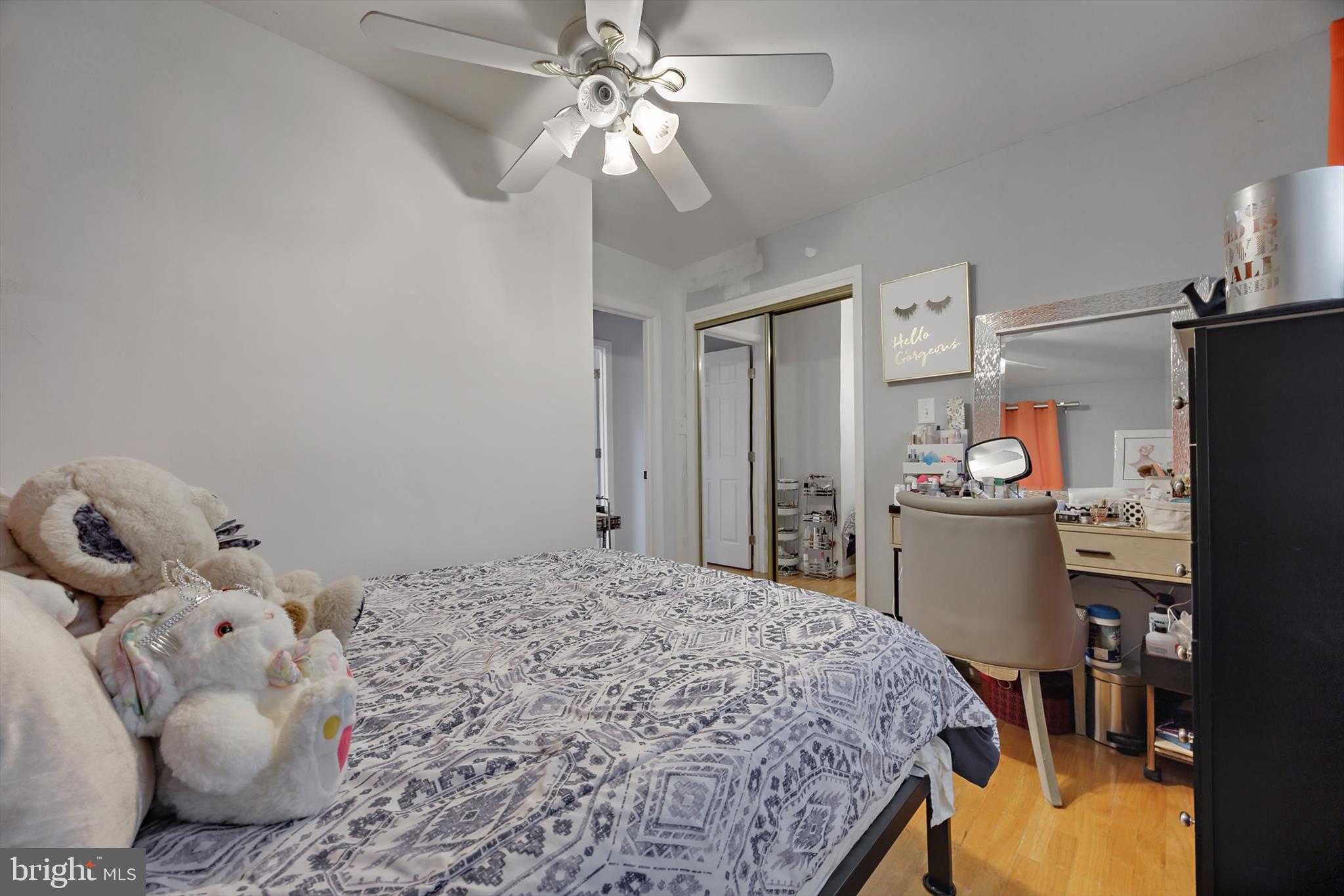 11406 Accolade Terrace Clinton, MD 20735 - Photo 15 of 45 a bedroom with a bed and wooden floor