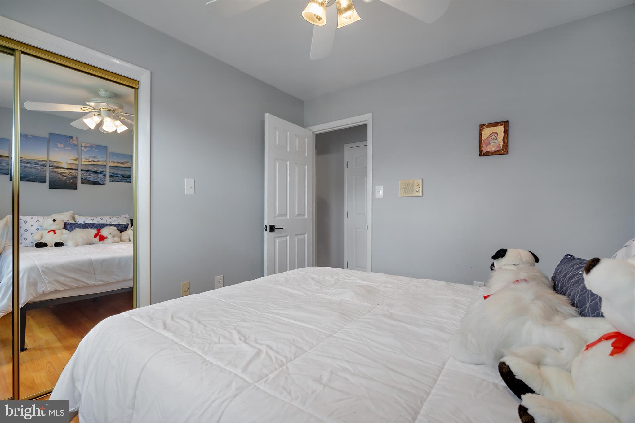 11406 Accolade Terrace Clinton, MD 20735 - Photo 17 of 45 a bedroom with a bed and a chandelier