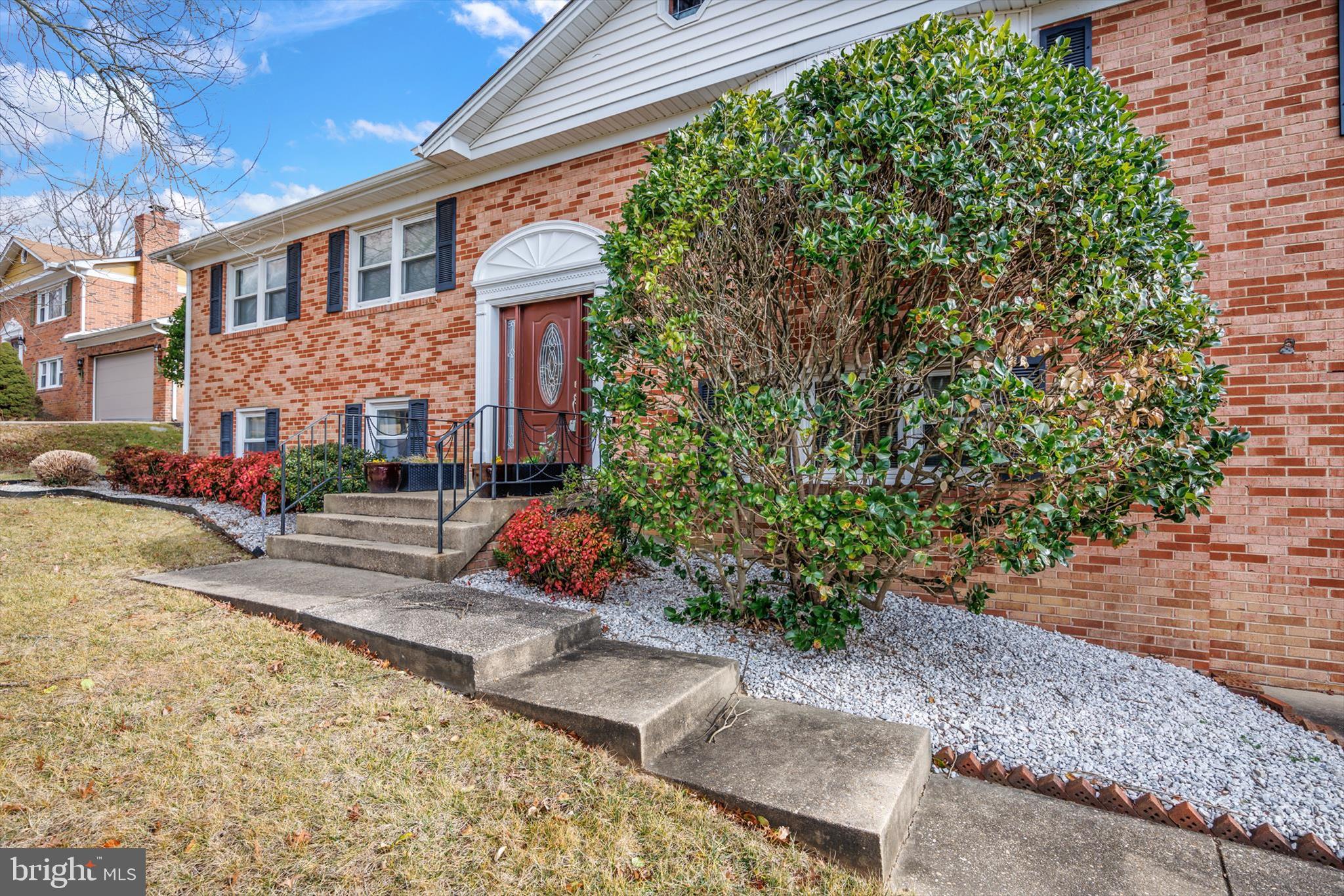11406 Accolade Terrace Clinton, MD 20735 - Photo 2 of 45 a front view of a house with a yard
