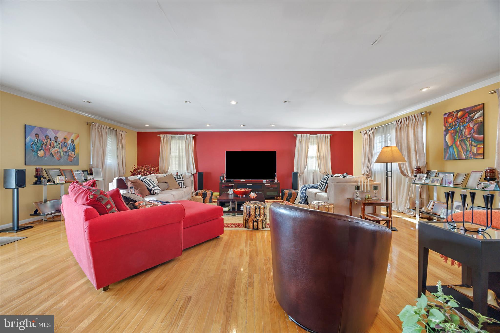 11406 Accolade Terrace Clinton, MD 20735 - Photo 24 of 45 a living room with furniture flat screen tv and a fireplace