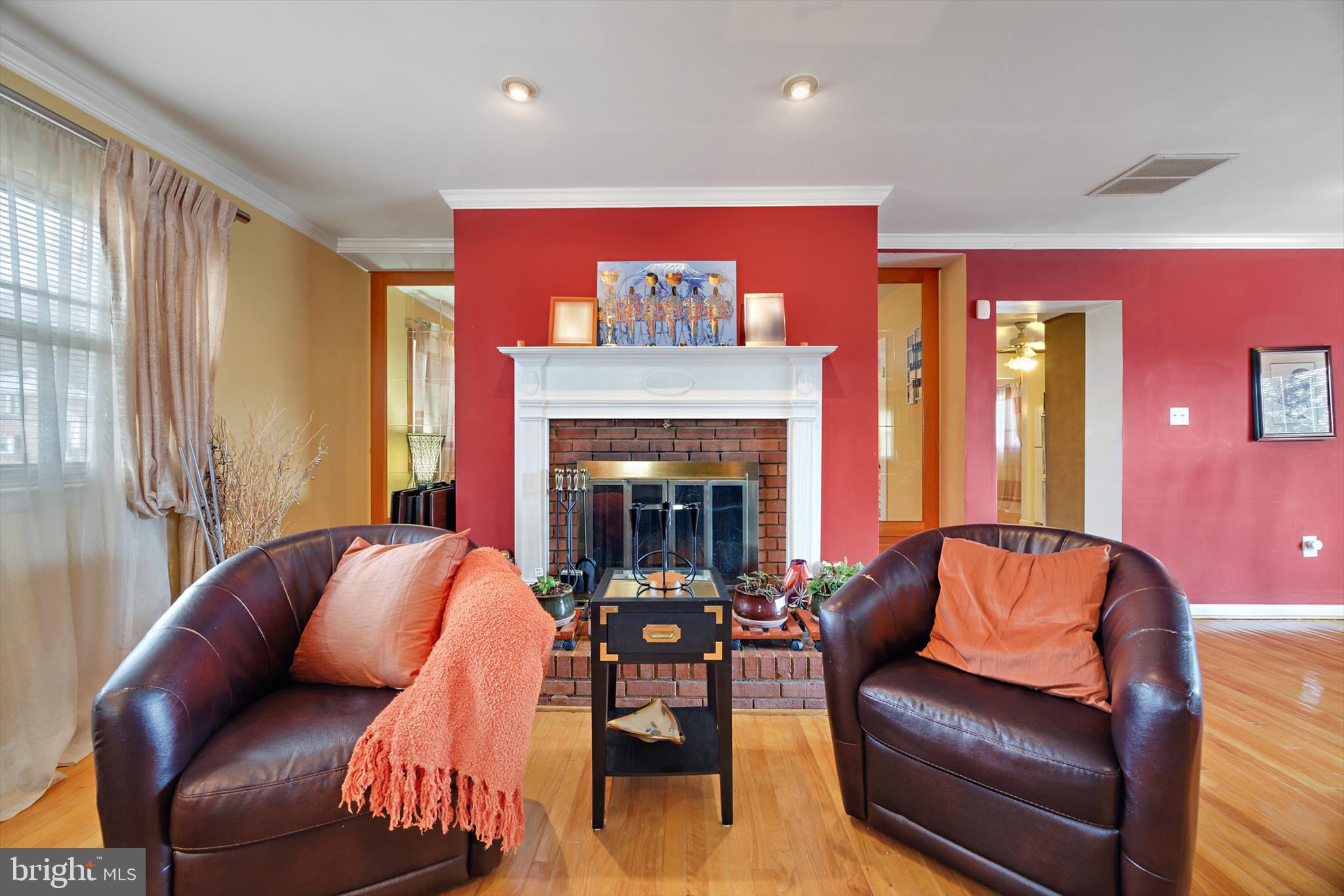 11406 Accolade Terrace Clinton, MD 20735 - Photo 27 of 45 a living room with furniture and a fireplace