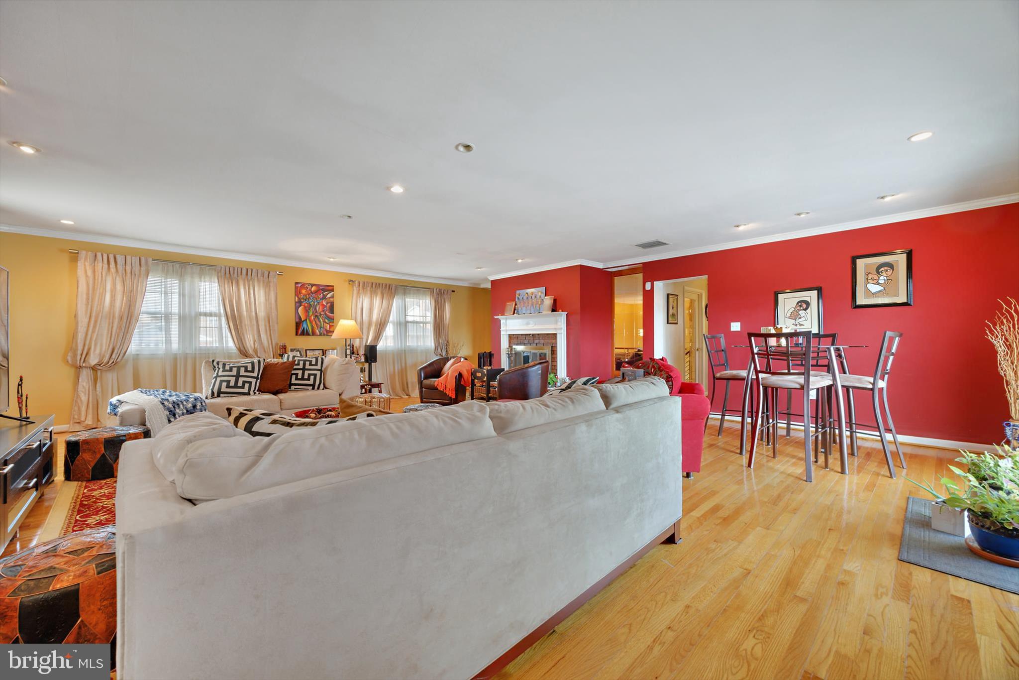 11406 Accolade Terrace Clinton, MD 20735 - Photo 29 of 45 a living room with furniture and a wooden floor