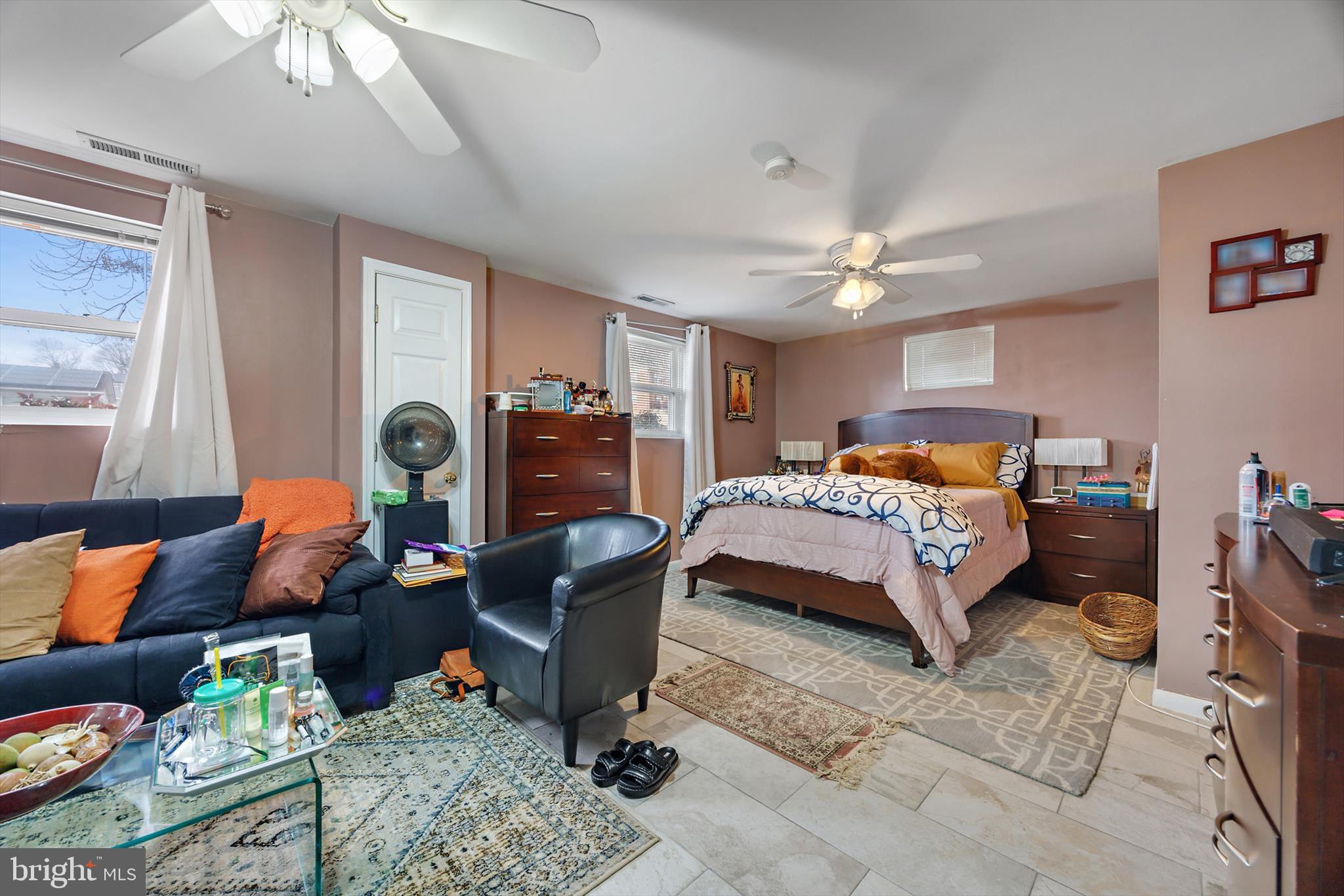 11406 Accolade Terrace Clinton, MD 20735 - Photo 30 of 45 a bedroom with a bed gym equipment and view of living room