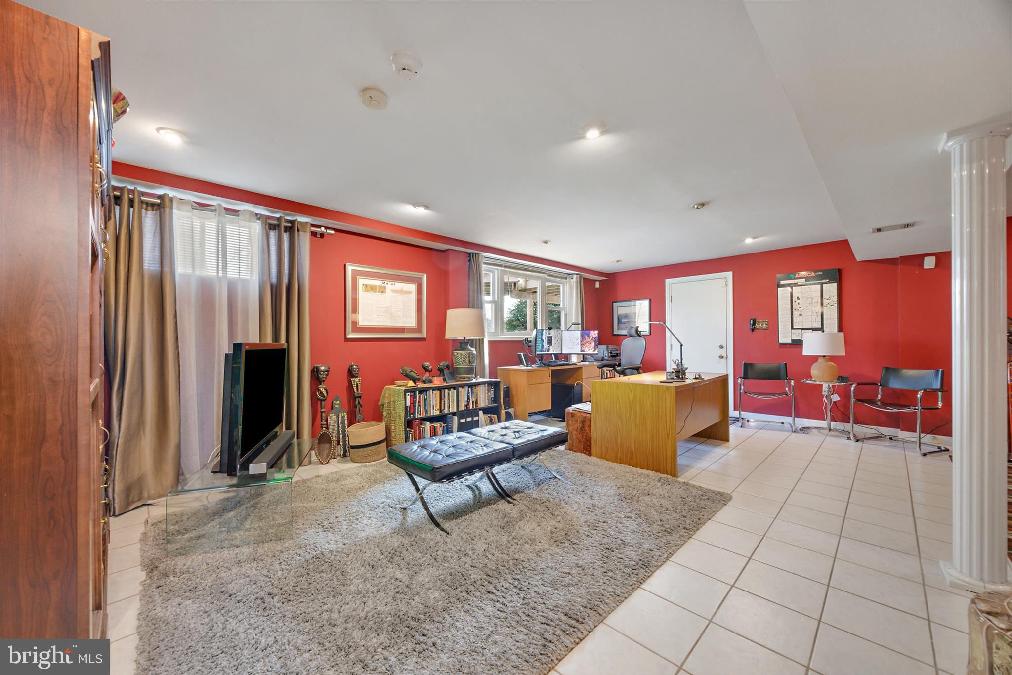 11406 Accolade Terrace Clinton, MD 20735 - Photo 34 of 45 a living room with furniture and a fireplace