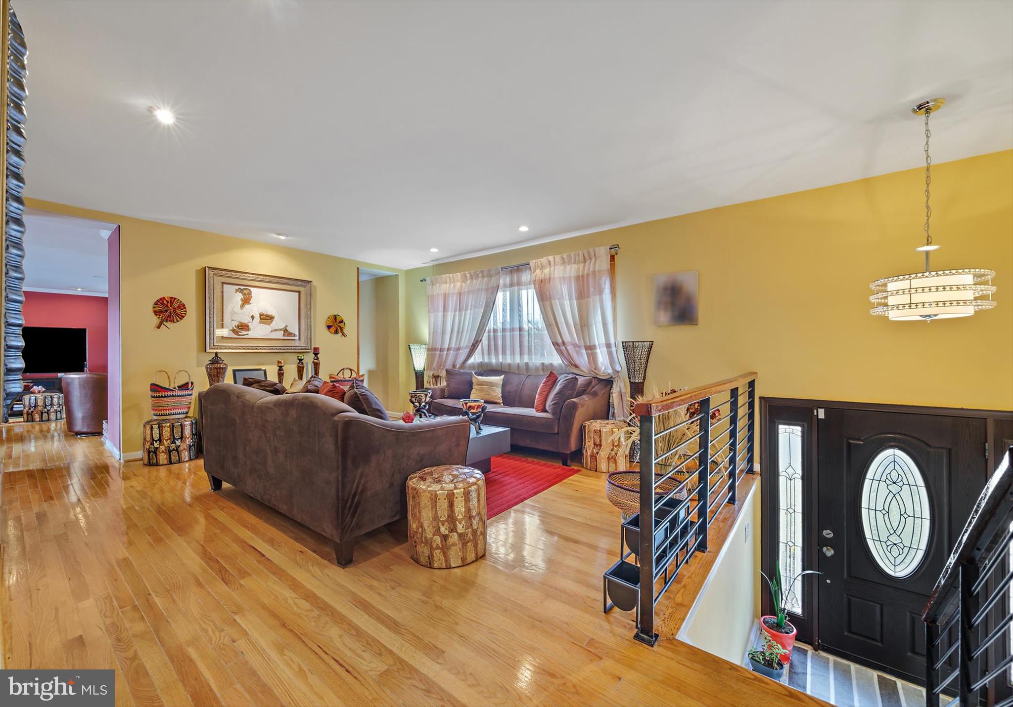 11406 Accolade Terrace Clinton, MD 20735 - Photo 4 of 45 a living room with furniture a flat screen tv and a large window