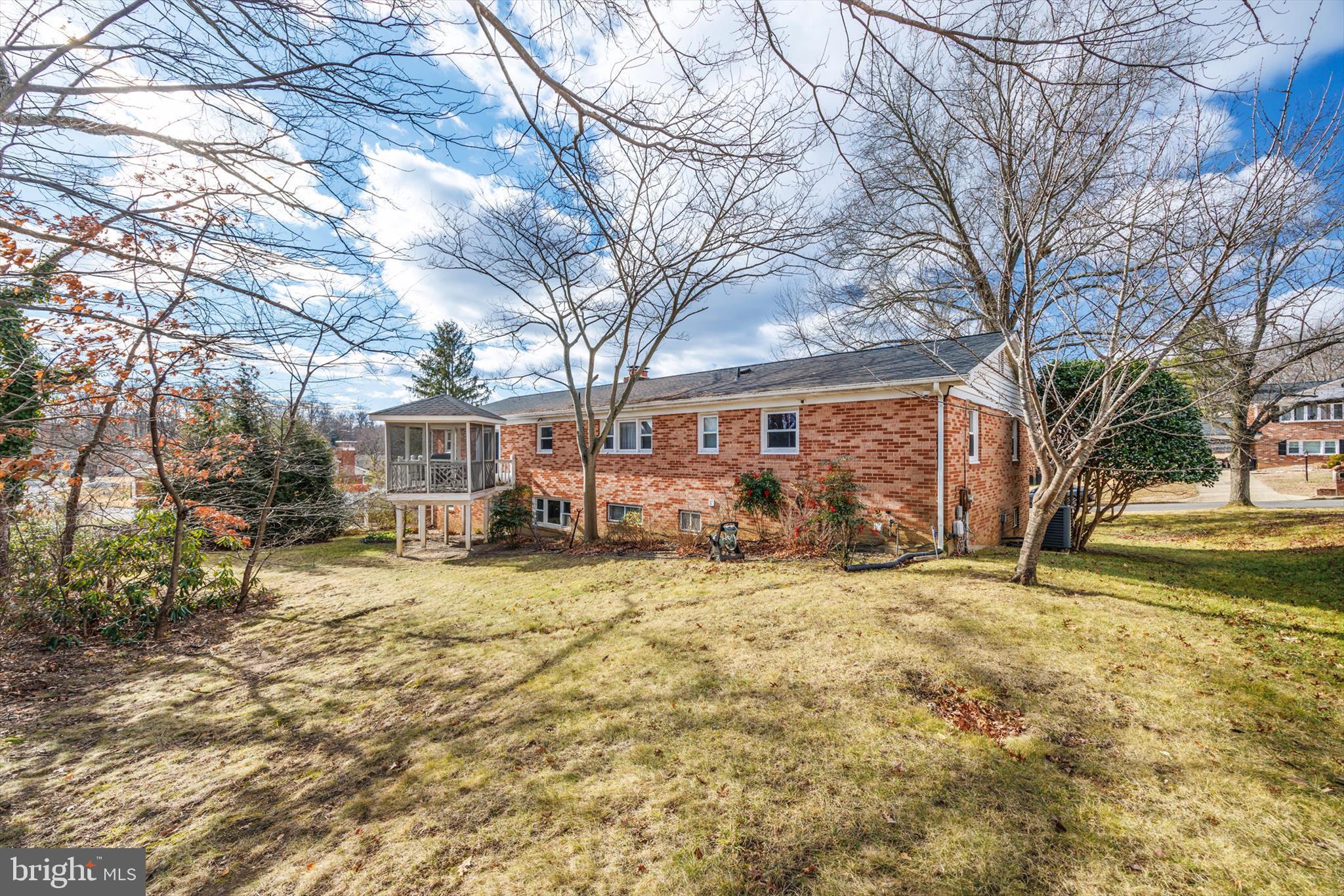 11406 Accolade Terrace Clinton, MD 20735 - Photo 41 of 45 a view of a yard with a large tree in a yard