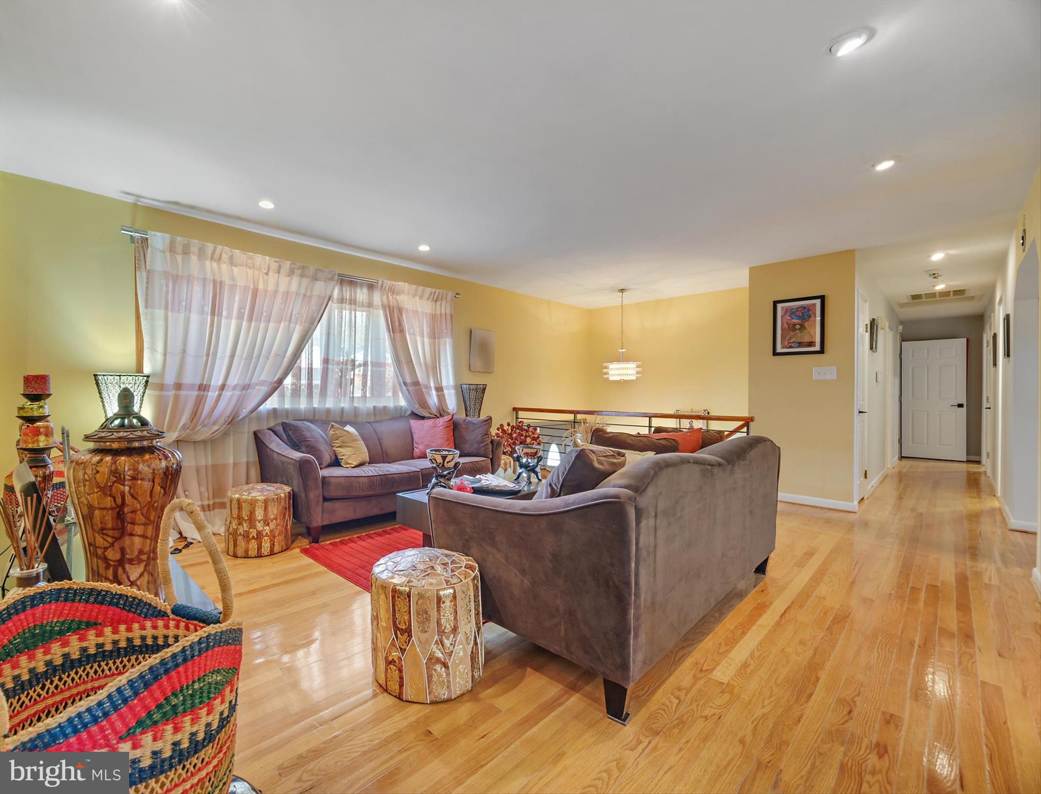 11406 Accolade Terrace Clinton, MD 20735 - Photo 5 of 45 a living room with furniture and a wooden floor
