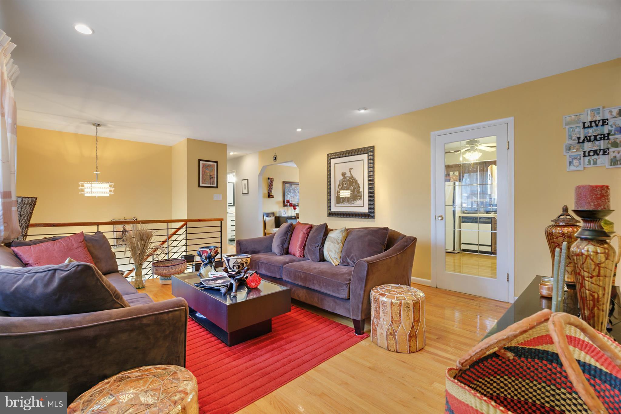11406 Accolade Terrace Clinton, MD 20735 - Photo 6 of 45 a living room with furniture or couch and a dresser with wooden floor