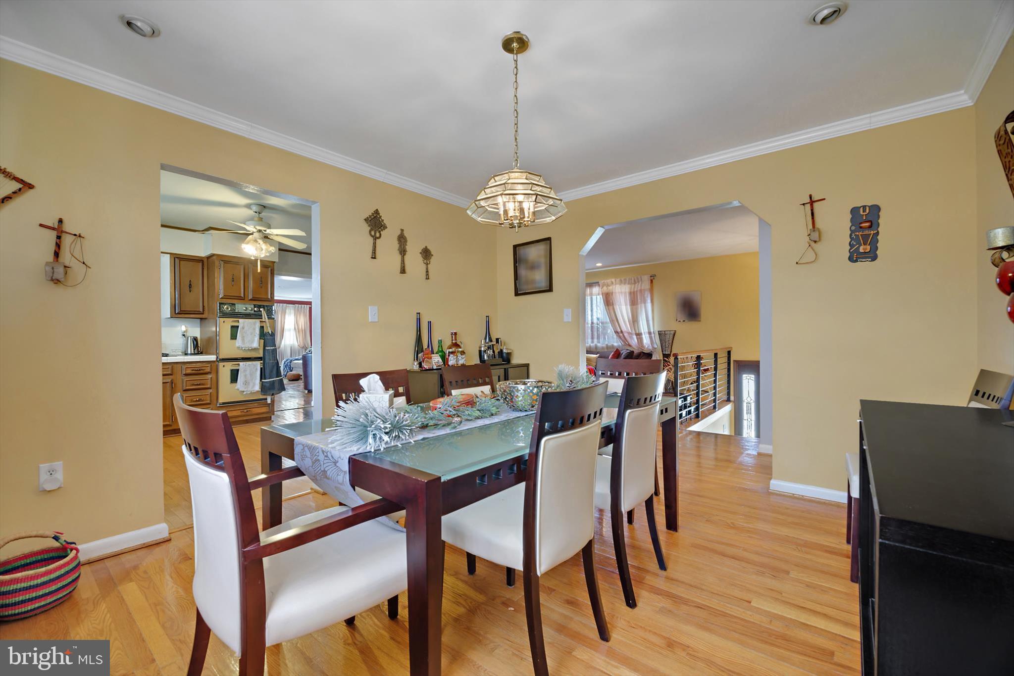 11406 Accolade Terrace Clinton, MD 20735 - Photo 9 of 45 a view of a dining room with furniture window and wooden floor