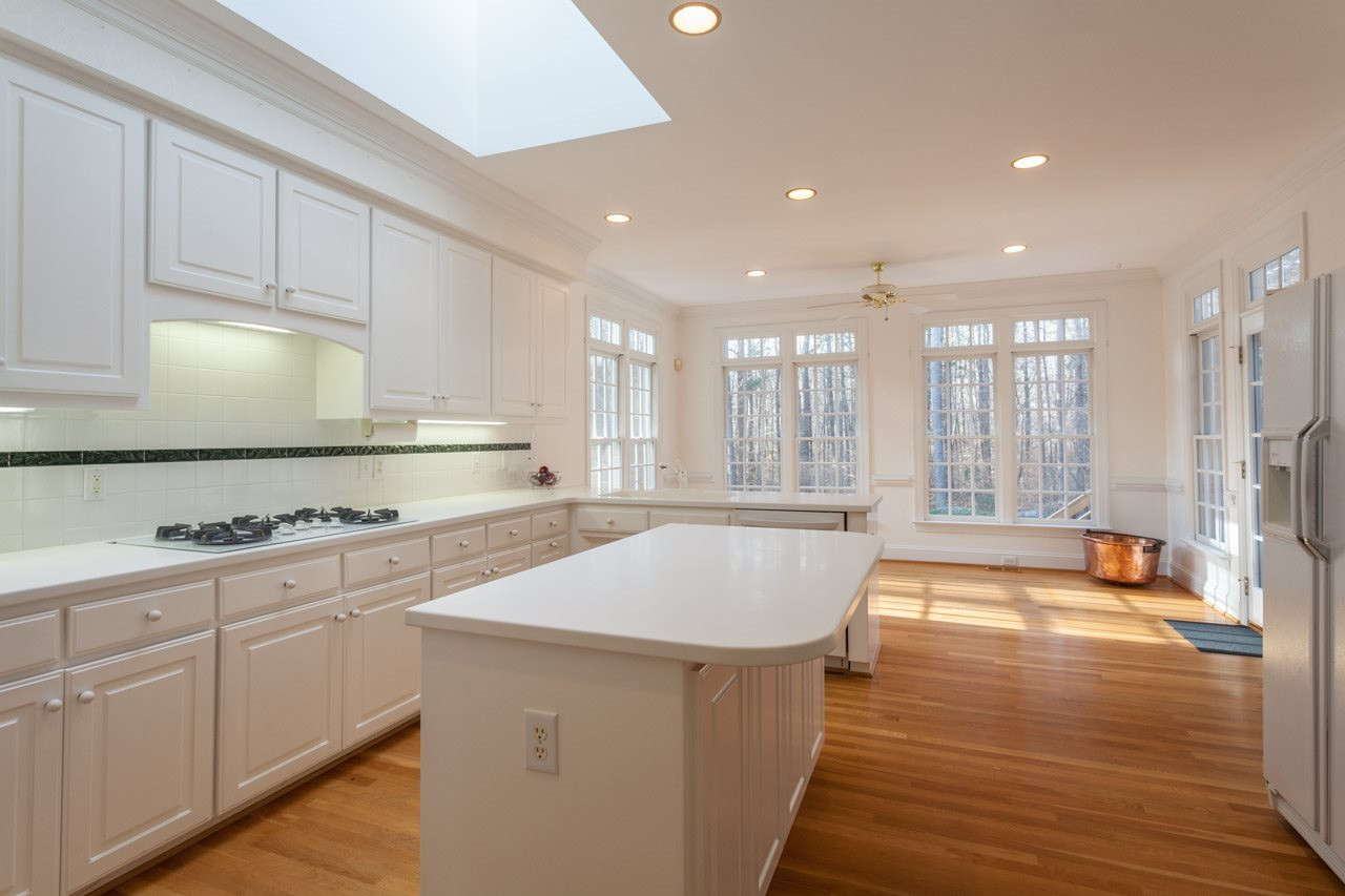 4000 White Chapel Way Raleigh, NC 27615 - Photo 10 of 25 The island, expansive cabinetry, desk area and pantry gives you ample room for all of your dining needs. Kitchen