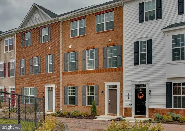 a front view of a building with many windows