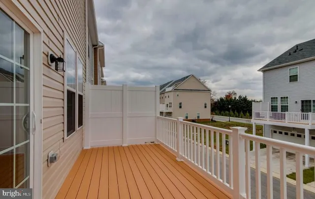 a view of a balcony with wooden floor