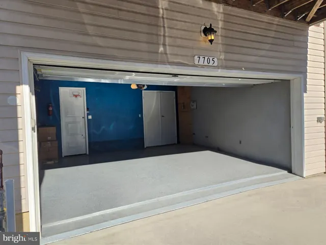 a city view with tall buildings and cars parked in front of it