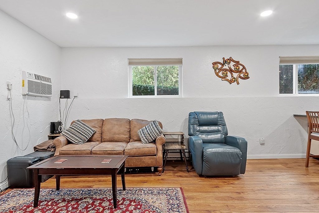 288 Swanson Road, Unit 202 Boxborough, MA 01719 - Photo 10 of 27 a living room with furniture and a rug