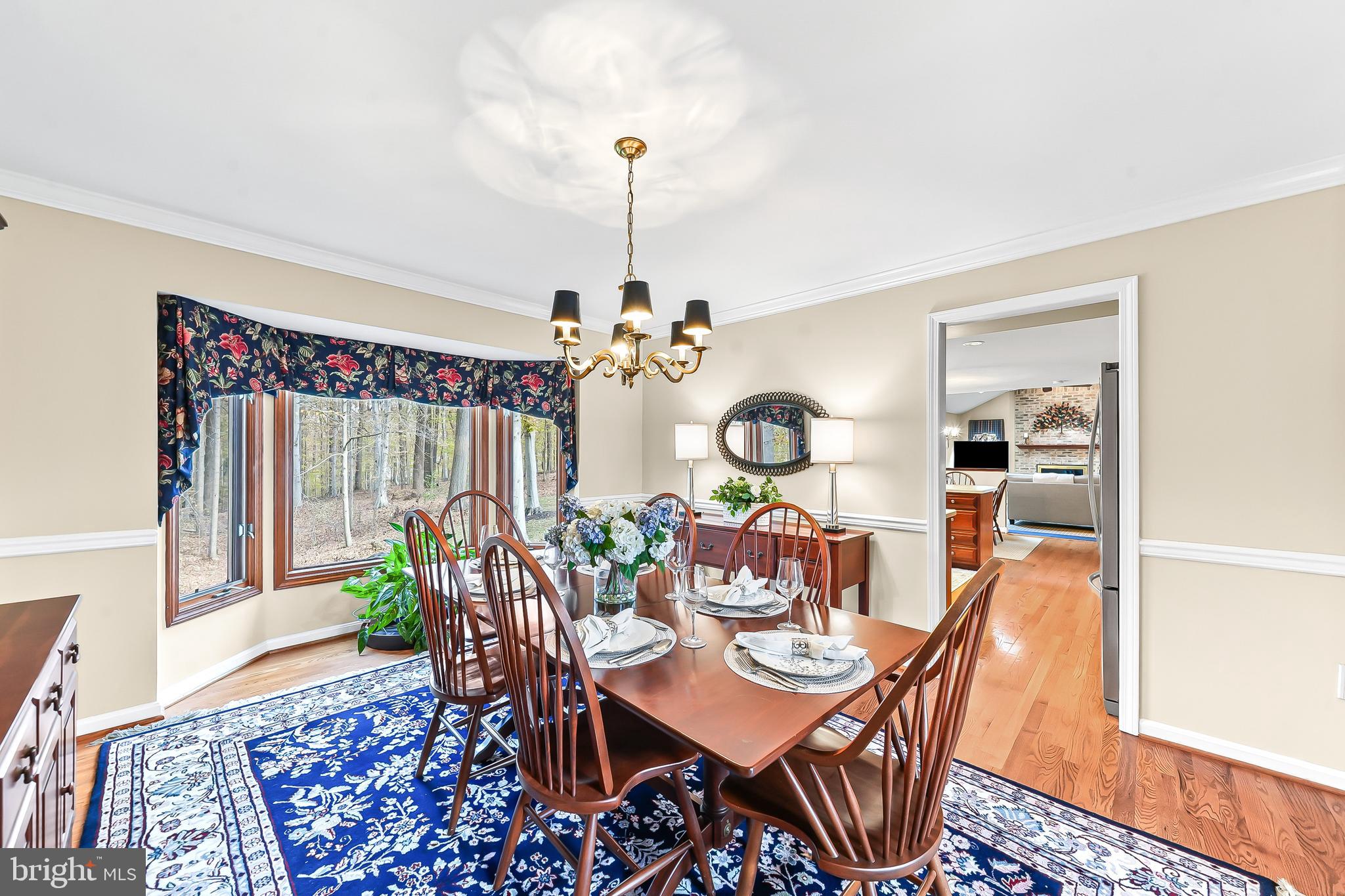 5 Copper Beech Court Landenberg, PA 19350 - Photo 11 of 38 a view of a dining room with furniture window and wooden floor