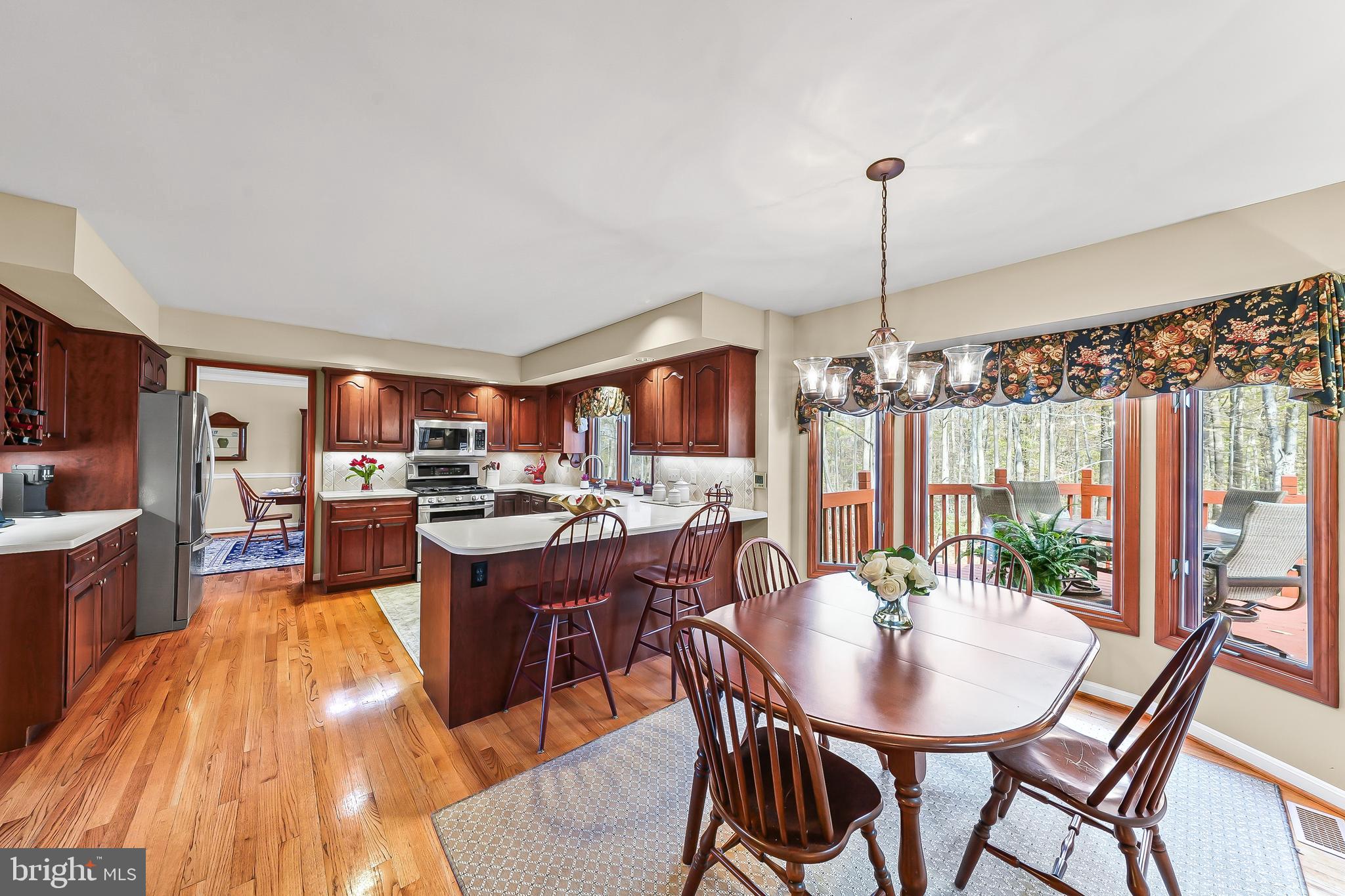 5 Copper Beech Court Landenberg, PA 19350 - Photo 12 of 38 a view of a dining room with furniture window and wooden floor