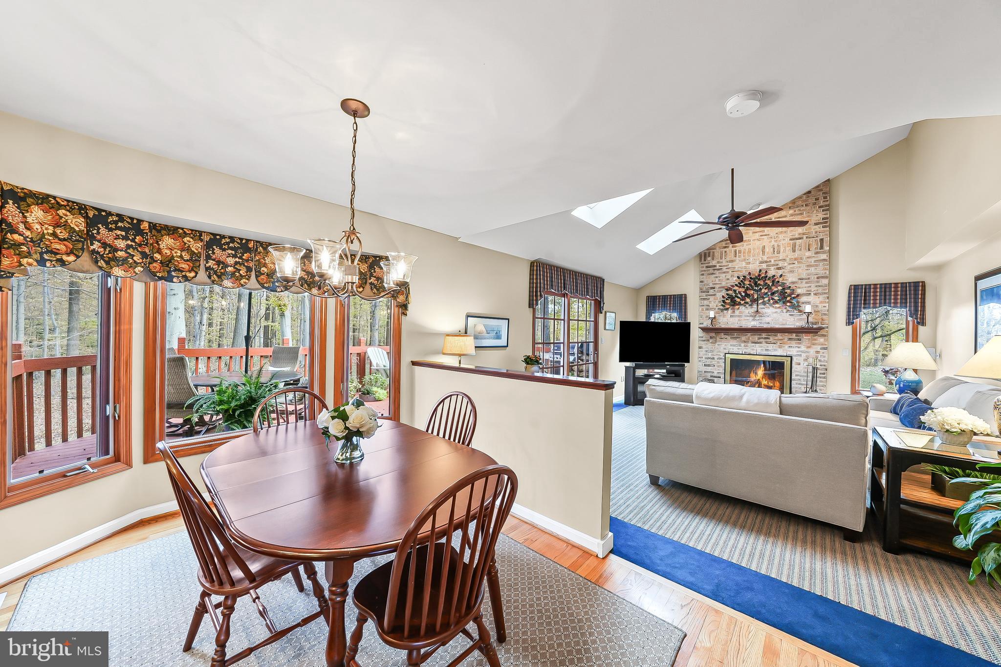 5 Copper Beech Court Landenberg, PA 19350 - Photo 16 of 38 a living room with furniture a flat screen tv and a table