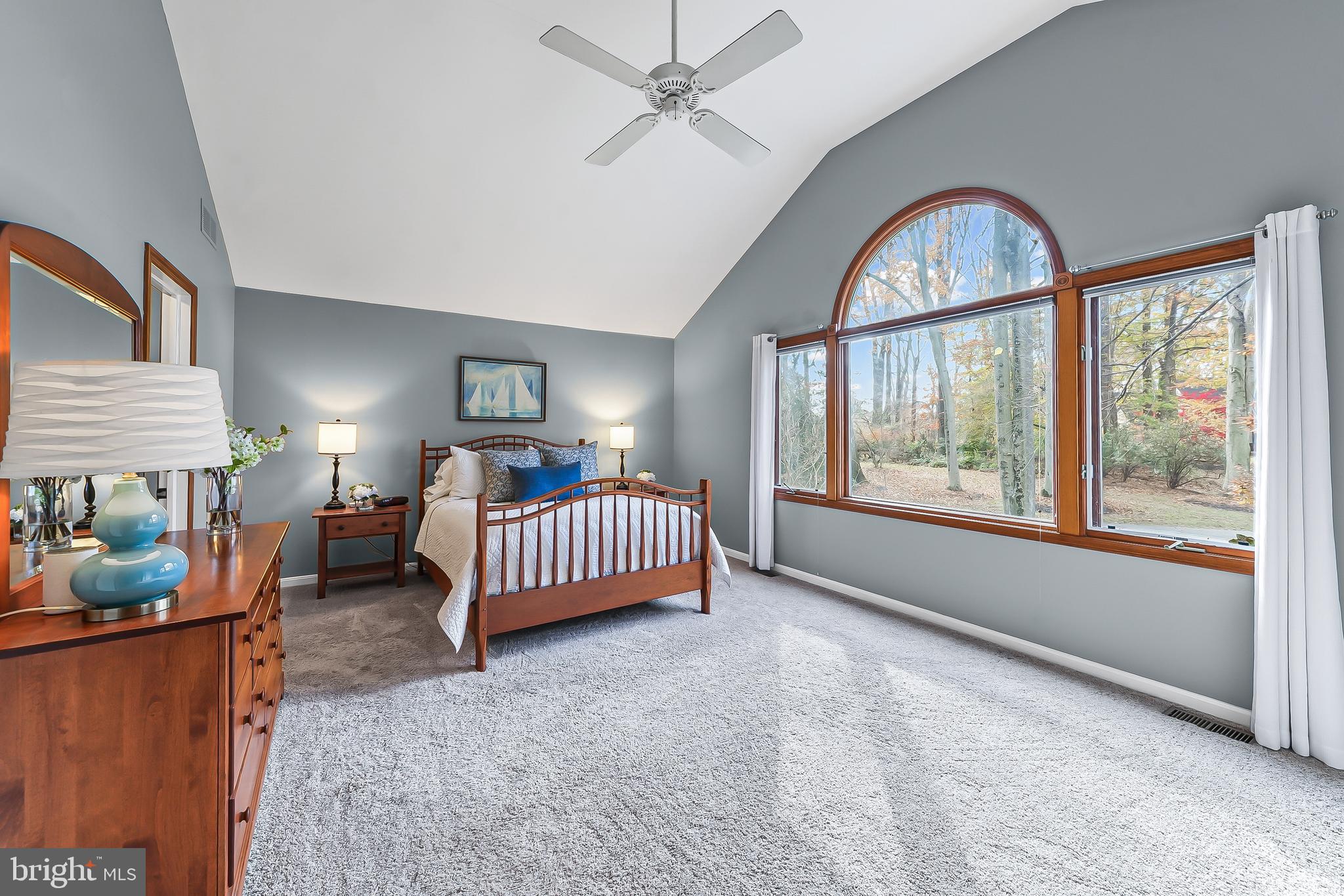 5 Copper Beech Court Landenberg, PA 19350 - Photo 27 of 38 a bedroom with a bed and a large window
