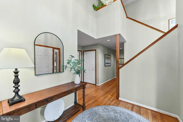 a view of living room with furniture and wooden floor