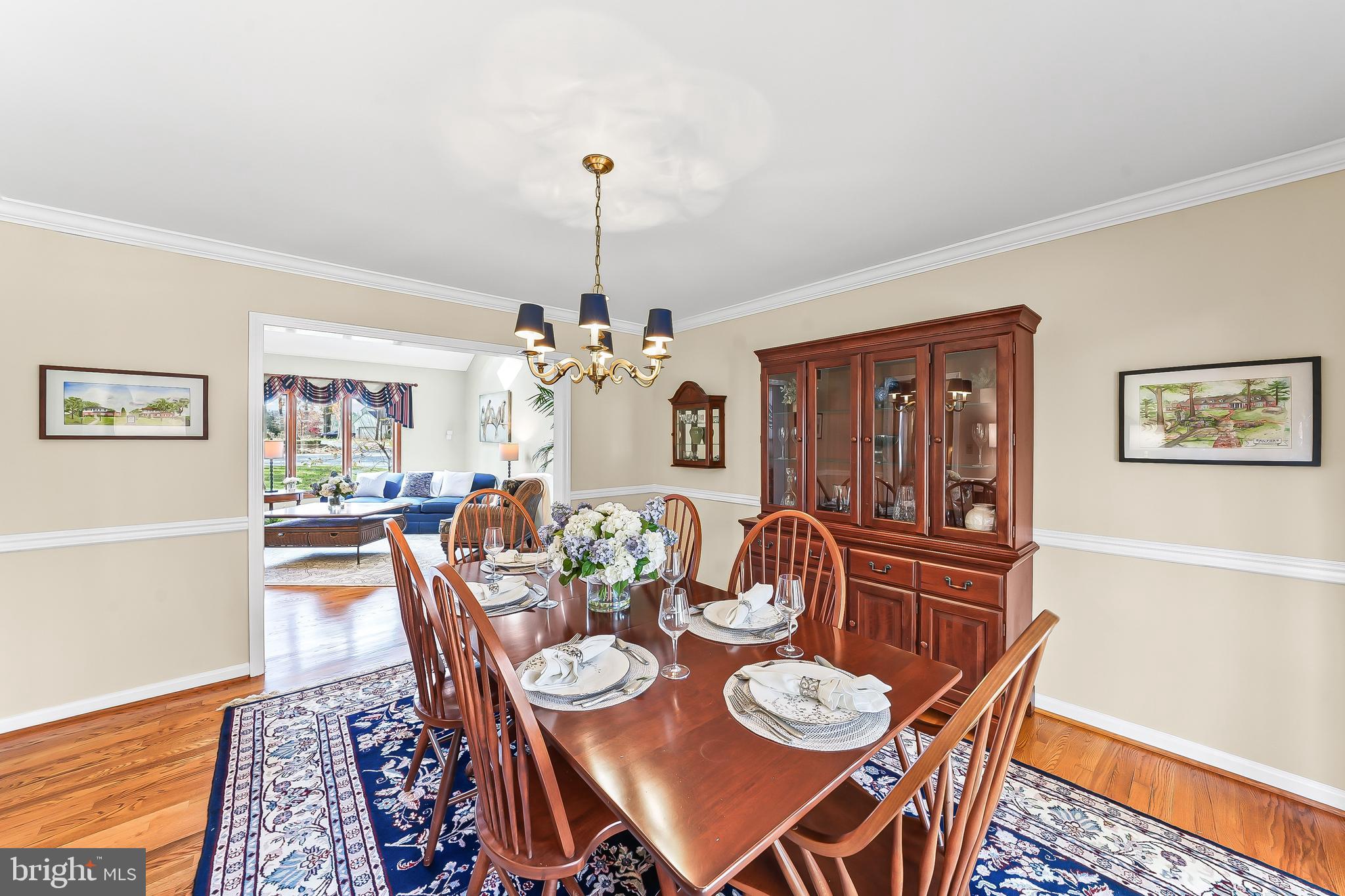 5 Copper Beech Court Landenberg, PA 19350 - Photo 9 of 38 a view of a dining room with furniture wooden floor and a chandelier
