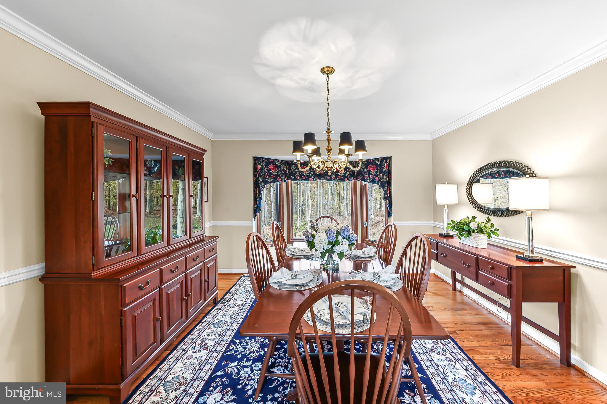 5 Copper Beech Court Landenberg, PA 19350 - Photo 10 of 38 a view of a dining room with furniture window and wooden floor