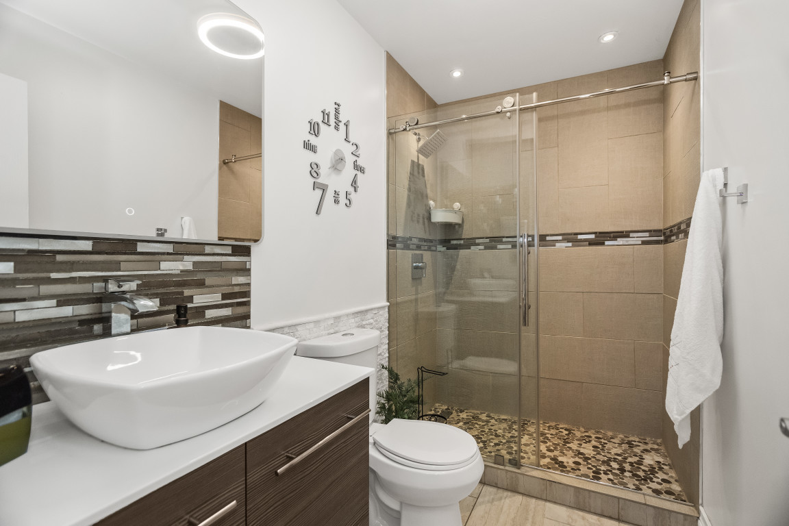 1811 Lyons Street Evanston, IL 60201 - Photo 12 of 33 a bathroom with a sink toilet and shower