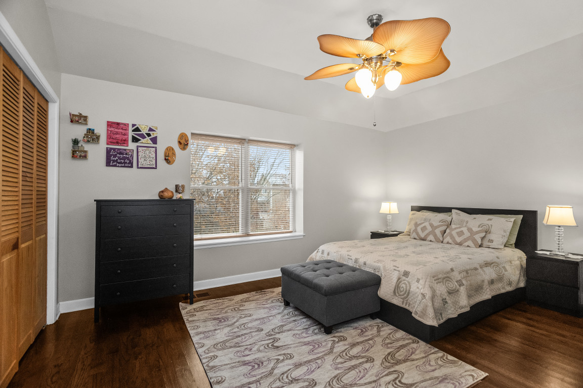 1811 Lyons Street Evanston, IL 60201 - Photo 13 of 33 a bedroom with a bed and a chandelier