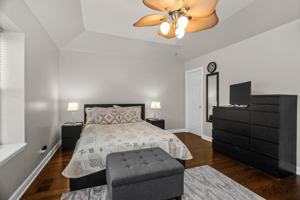 1811 Lyons Street Evanston, IL 60201 - Photo 14 of 33 a bedroom with a bed and wooden floor