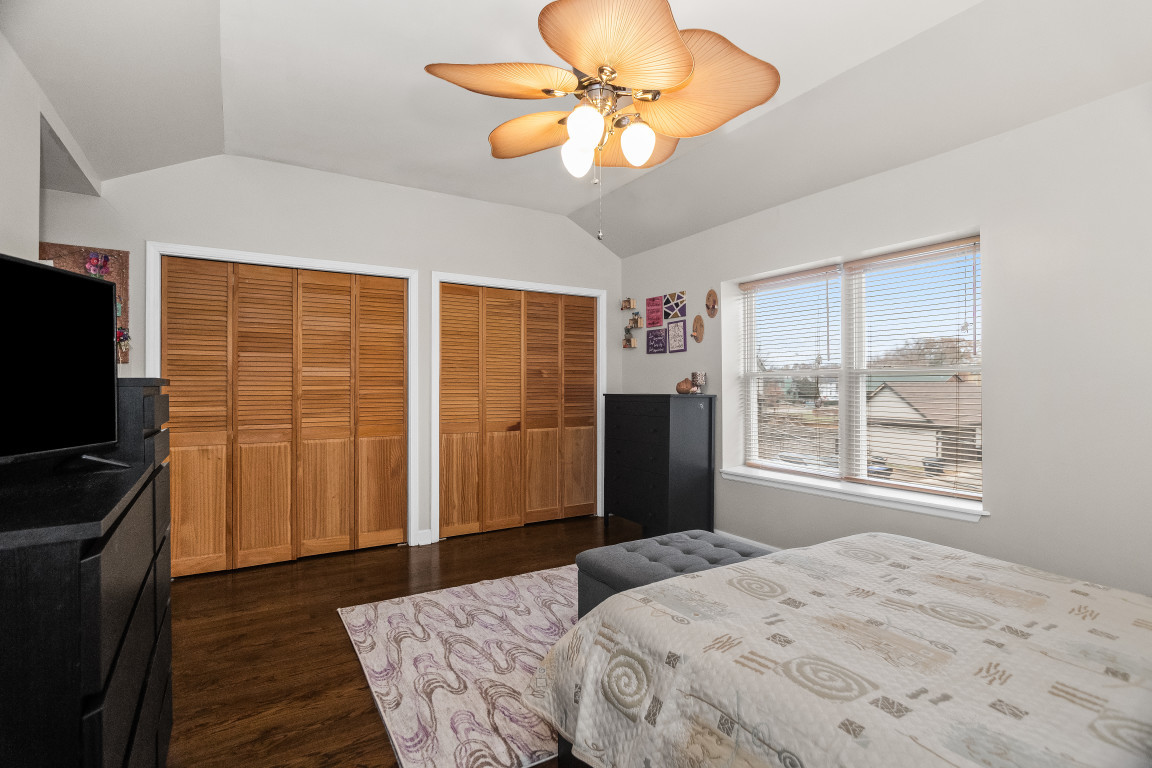1811 Lyons Street Evanston, IL 60201 - Photo 15 of 33 a bedroom with a bed and a chandelier